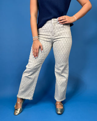 light gray patterned denim jeans with a textured geometric design