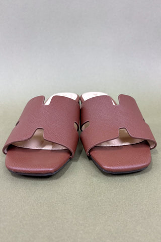 Pair of pink slides on a light gray background