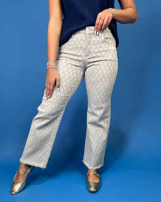 light gray patterned denim jeans with a textured geometric design