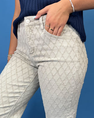light gray patterned denim jeans with a textured geometric design