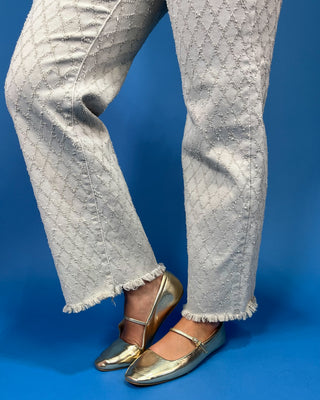 light gray patterned denim jeans with a textured geometric design
