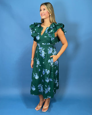 Emerald green floral midi dress with blue rose print, dramatic ruffle sleeves, and a V-neckline.