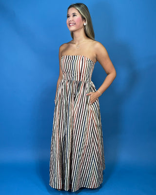 Strapless multicolor striped maxi dress with a fitted bodice, gathered waist, flowy skirt, and side pockets.