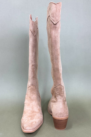 Pair of pink suede knee-high boots on a gray background