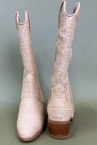 Pair of beige woven cowboy boots on a gray background