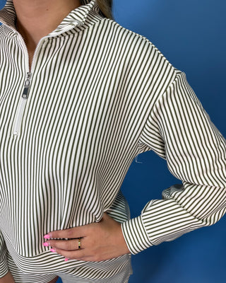 Cream and olive striped quarter zip shorts set with long sleeves, drawstring waist, and side pockets.