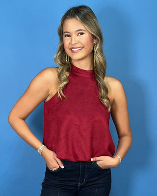 Burgundy sleeveless mock neck top with a soft suede-like texture, relaxed fit, and chic everyday style.