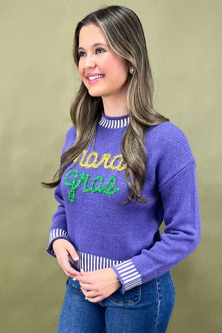 Woman wearing a purple sweater with text on a beige background