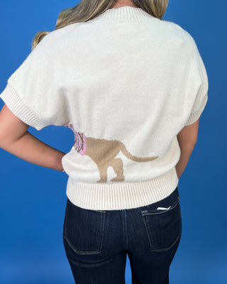 Ivory short sleeve knit sweater with a dachshund graphic wearing a pink argyle sweater.