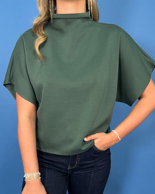 Hunter green mock neck top with relaxed short sleeves and a smooth, polished finish.