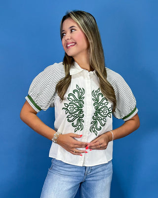 White button-up blouse with green embroidery, striped puff sleeves, and a collared neckline, shown on model.