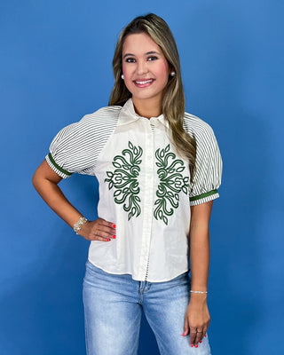 White button-up blouse with green embroidery, striped puff sleeves, and a collared neckline, shown on model.