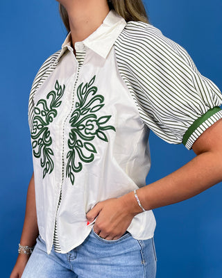 White button-up blouse with green embroidery, striped puff sleeves, and a collared neckline, shown on model.