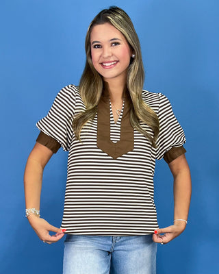 Brown and cream striped top with contrast collar, split neckline, and puff sleeves, shown on model.