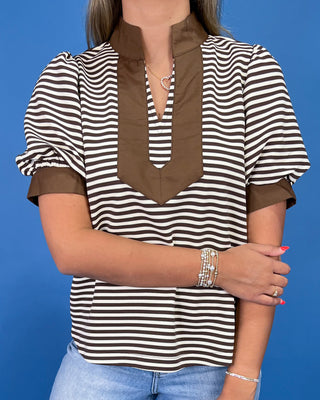 Brown and cream striped top with contrast collar, split neckline, and puff sleeves, shown on model.
