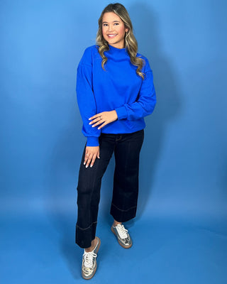 Royal blue long sleeve mock neck sweatshirt top with a relaxed fit and soft casual silhouette.