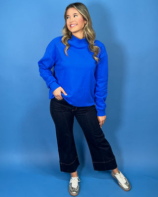 Royal blue long sleeve mock neck sweatshirt top with a relaxed fit and soft casual silhouette.