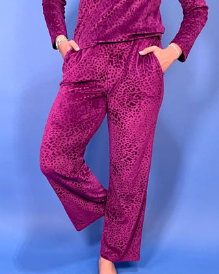 Burgundy velvet animal print lounge set with a V-neck long sleeve top and matching relaxed-fit pants.