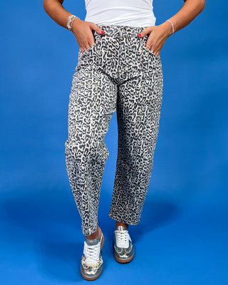 Gray leopard print barrel jeans with patch pockets, high-rise waist, and relaxed fit, shown on model.