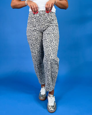 Gray leopard print barrel jeans with patch pockets, high-rise waist, and relaxed fit, shown on model.