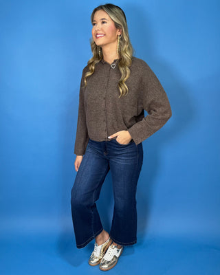 Brown heathered knit button-front cardigan with a collared neckline, long sleeves, relaxed fit, and cropped hem.