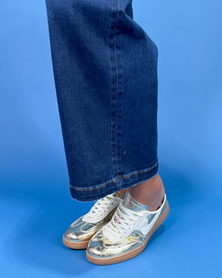 Dark wash wide leg jeans with a high-rise waist and full-length silhouette, shown on model.