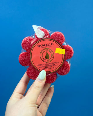 Spongellé Flower Body Wash Infused Buffer available in multiple fragrances, featuring a flower-shaped cleansing sponge infused with body wash and a convenient hanging ribbon.