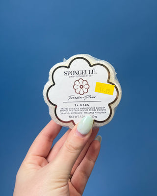 Spongellé Daisy Spongettes travel-sized body wash infused buffer available in multiple fragrances, featuring a flower-shaped cleansing sponge with gentle exfoliation and 7+ uses.