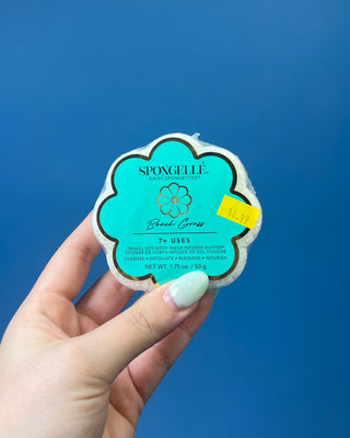 Spongellé Daisy Spongettes travel-sized body wash infused buffer available in multiple fragrances, featuring a flower-shaped cleansing sponge with gentle exfoliation and 7+ uses.