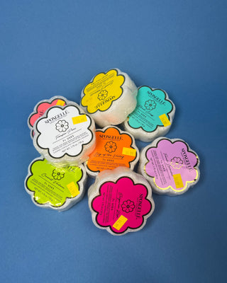 Spongellé Daisy Spongettes travel-sized body wash infused buffer available in multiple fragrances, featuring a flower-shaped cleansing sponge with gentle exfoliation and 7+ uses.
