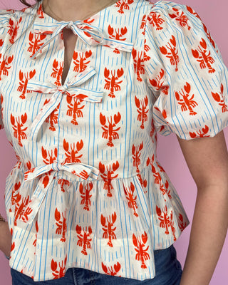 Top with red lobster pattern on a white background