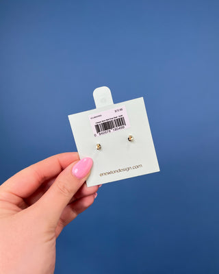 eNewton Classic 8mm Ball Drop Stud Earrings in classic gold featuring polished gold ball studs with suspended 8mm gold ball drops and secure post backs displayed on an eNewton jewelry card.
