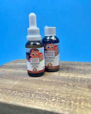 Punkin Butt Natural Teething Oil available in 1 oz and 2 oz dropper bottles for babies, featuring a naturally derived formula designed to help soothe teething discomfort.