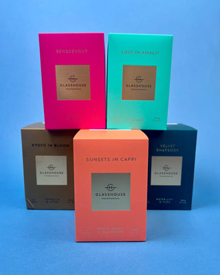Glasshouse Fragrances 380g luxury soy candle collection featuring Lost in Amalfi, Sunsets in Capri, Kyoto in Bloom, Rendezvous, and Velvet Rhapsody candles in colorful designer gift boxes with premium glass candle vessels.