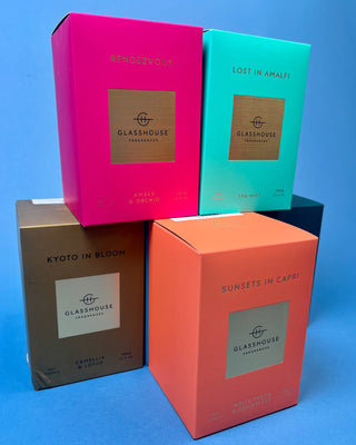Glasshouse Fragrances 380g luxury soy candle collection featuring Lost in Amalfi, Sunsets in Capri, Kyoto in Bloom, Rendezvous, and Velvet Rhapsody candles in colorful designer gift boxes with premium glass candle vessels.