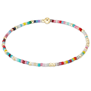 Multicolored beaded necklace with gold accents on a white background