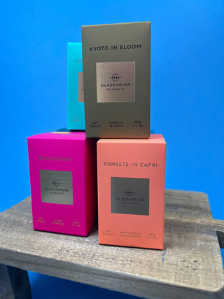 Glasshouse Fragrances 2.1 oz mini soy candle collection featuring luxury glass candles in multiple signature scents including Lost in Amalfi, Kyoto in Bloom, Rendezvous, Velvet Rhapsody, and Sunsets in Capri.
