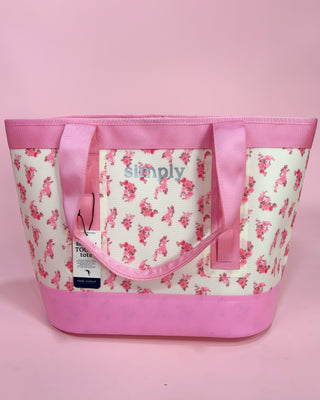 Pink and white floral tote bag with 'Simply' branding on a pink background