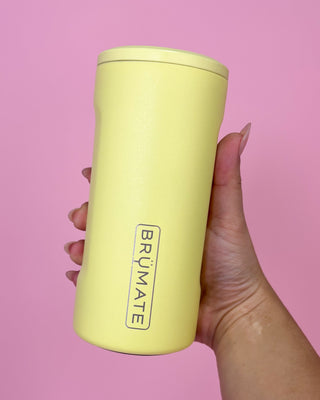 Yellow tumbler with 'BRUMATE' branding held against a pink background