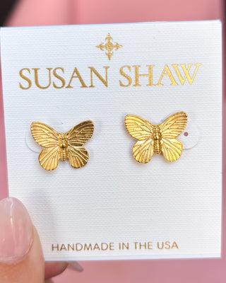 Gold butterfly earrings on a Susan Shaw branded card with 'Handmade in the USA' text.