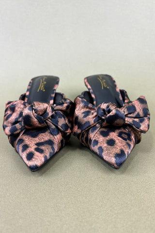 Pair of leopard print hair scrunchies on a light gray background