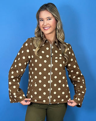 Brown polka dot zip-up jacket with a collared neckline, long sleeves, front pockets, and a relaxed fit.