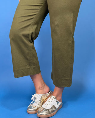 Olive green high-rise cropped wide leg pants with scalloped front patch pockets and a flattering structured fit.