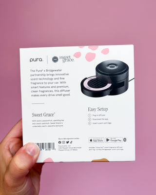 Pura diffuser packaging with 'Sweet Grace' fragrance on a pink background