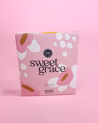 Pink packaging of 'sweet grace' by pura on a pink background