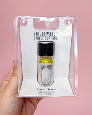 Bridgewater Candle Company Sweet Grace home fragrance oil packaging on a pink background