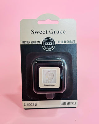 Sweet Grace car freshener clip in packaging on a pink background