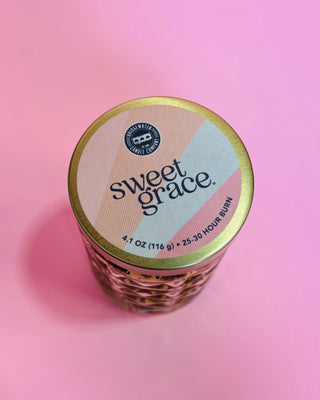 Jar of 'sweet grace' on a pink background