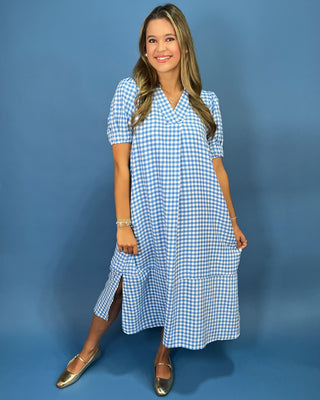 g a blue and white gingham midi dress with short puff sleeves, a V-neck, and side pockets