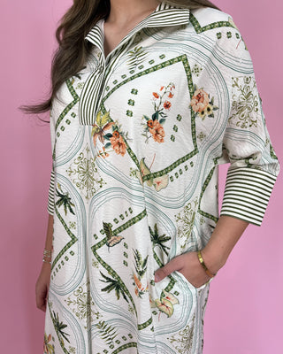Woman wearing a floral and geometric patterned outfit on a pink background